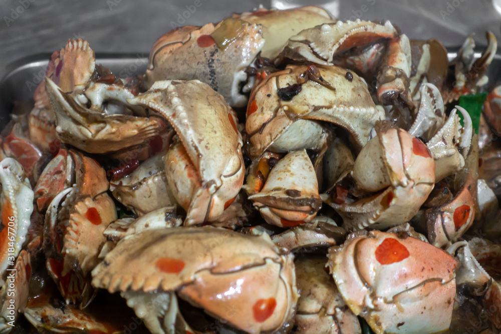 A plate of delicious spicy crab claws A plate of delicious spicy crab claws