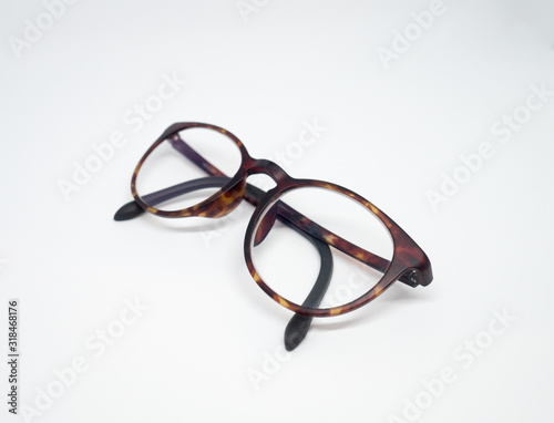 A pair of light weight stylish brown frame prescription glasses on white background.