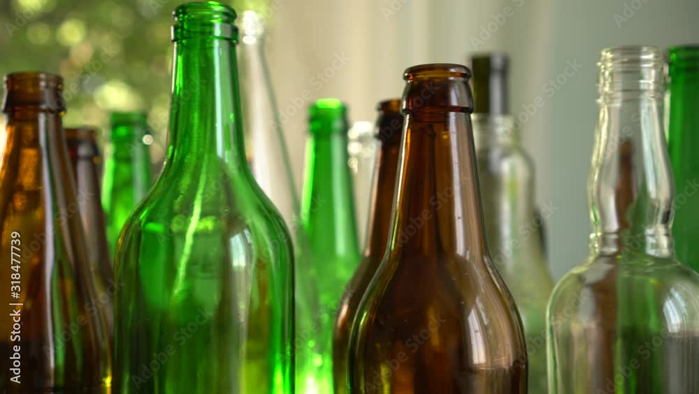 Bottles and jars in different colors. Glass used for food and drinks packaging. Glass recycling Bottles and jars in different colors. Glass used for food and drinks packaging. Glass recycling