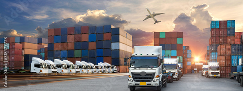 Container truck in ship port for business Logistics and transportation of Container Cargo ship and Cargo plane with working crane bridge in shipyard at sunrise, logistic import export and transport 