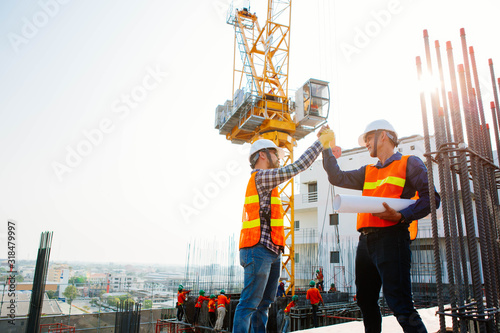 Engineers oversaw the construction site skyscraper. photo