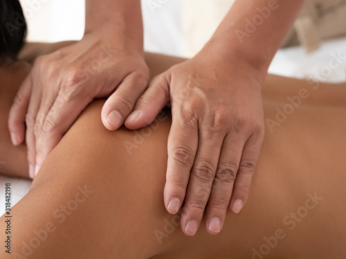 Close-up of hand masseuse in the Spa Salon. Thai massage for health.