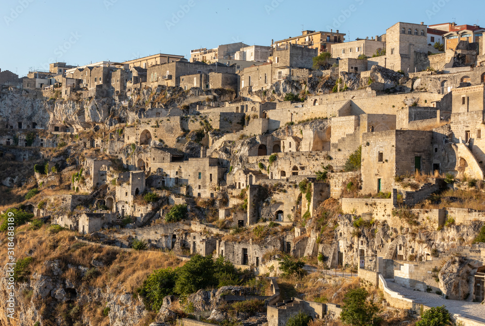 View of the Sassi di Matera a historic district in the city of Matera, well-known for their ancient cave dwellings. Basilicata. Italy View of the Sassi di Matera a historic district in the city of Matera, well-known for their ancient cave dwellings. Basilicata. Italy