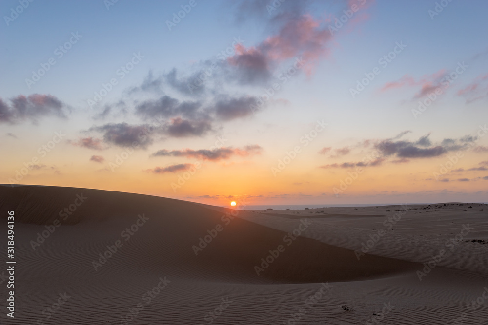 Sand dunes in the National Park of Dunas de Corralejo during a beautiful sunset, Canary Islands - Fuerteventura