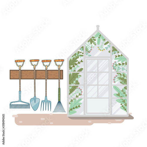 greenhouse with flowers inside. storing tools for working in the garden