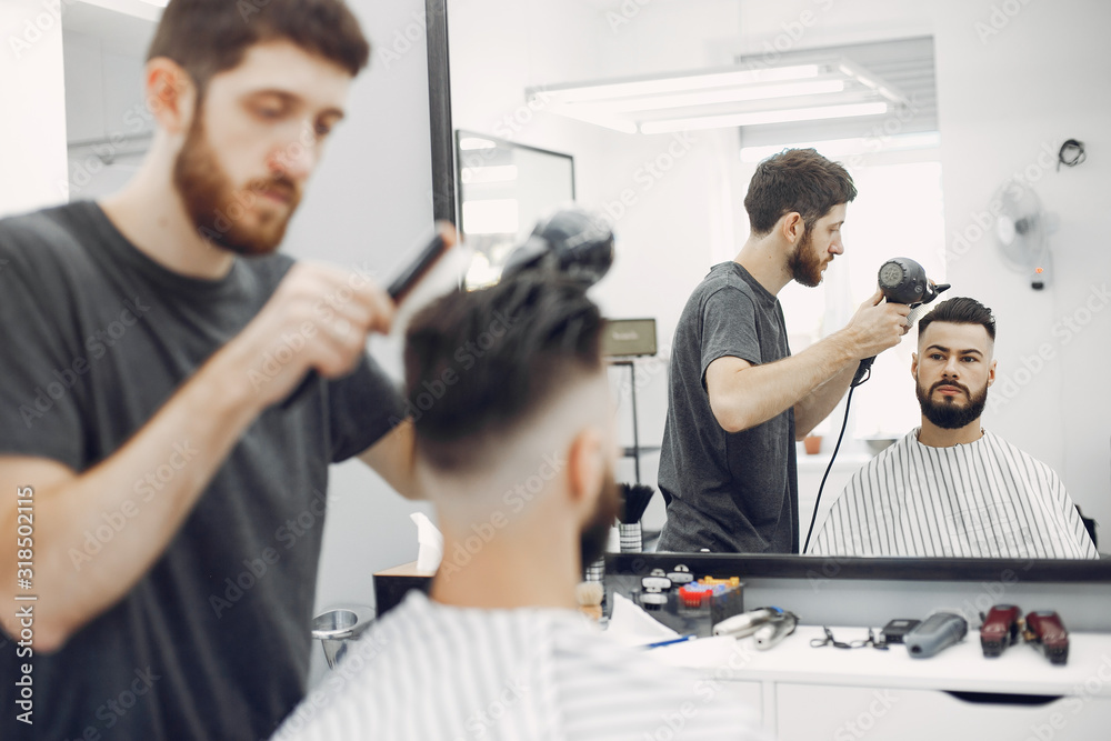 Man with a beard. Hairdresser with a client. Man with a beard. Hairdresser with a client.