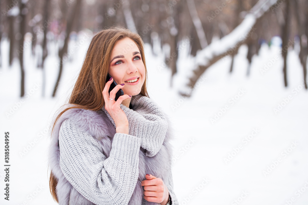Portrait of a young beautiful brunette brunette woman calling by phone Portrait of a young beautiful brunette brunette woman calling by phone