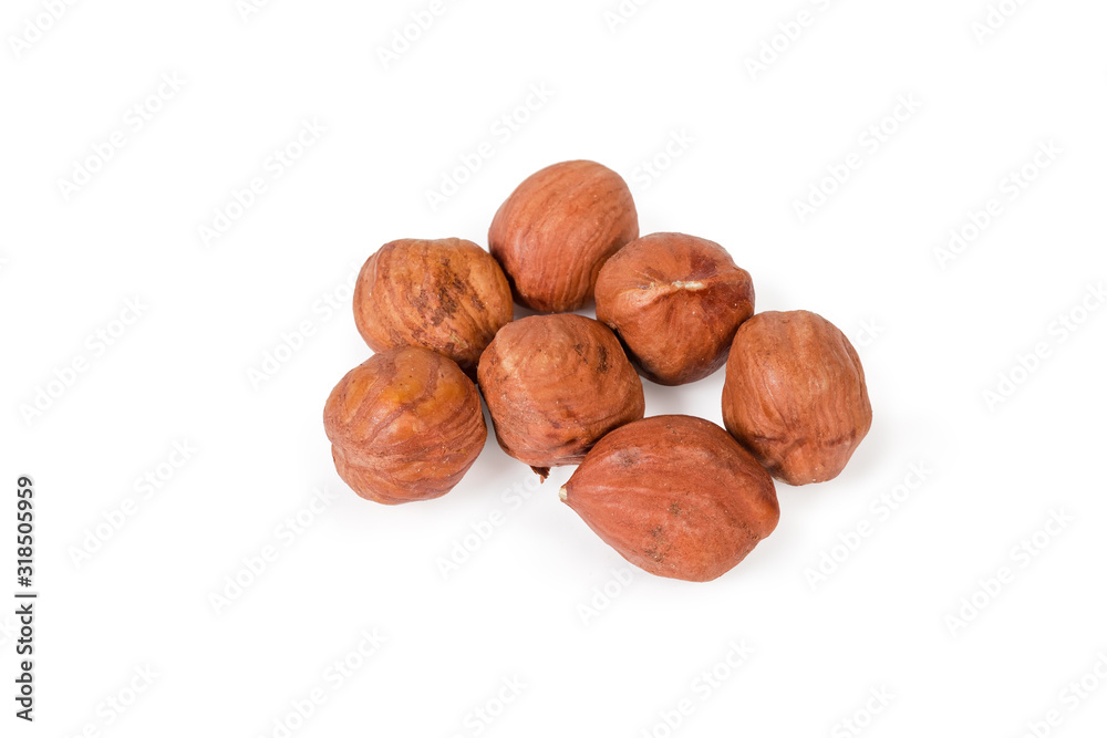 Ripe peeled hazelnuts on a white background Ripe peeled hazelnuts on a white background