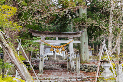 Torii gate of Shirakawa Hachiman Shinto Shrine in village of Shirakawago.