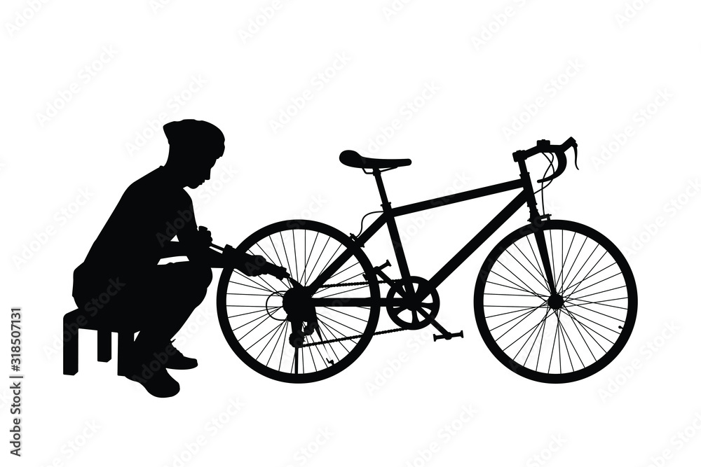 Obraz premium Young man with bike silhouette