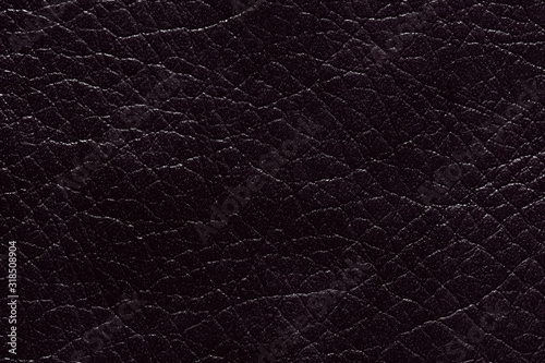 Stylish dermatin background in dark colour. photo
