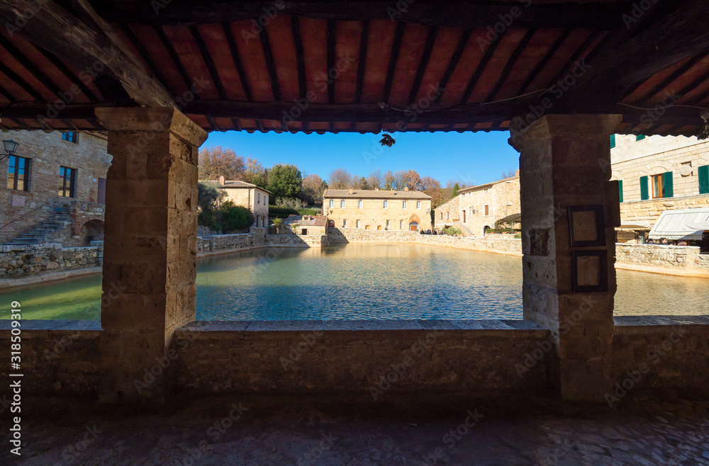 Fototapeta premium Bagno Vignoni (Italy) - A view of the famous thermal waters village in Val d'Orcia, Tuscany region province of Siena, beside Via Francigena religious street