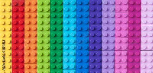 Many colorful toy bricks in top view. Toys and games. Leisure and recreation.