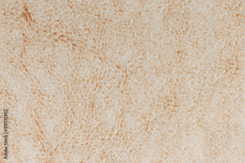 Leather light beige background, texture surface of genuine leather.
