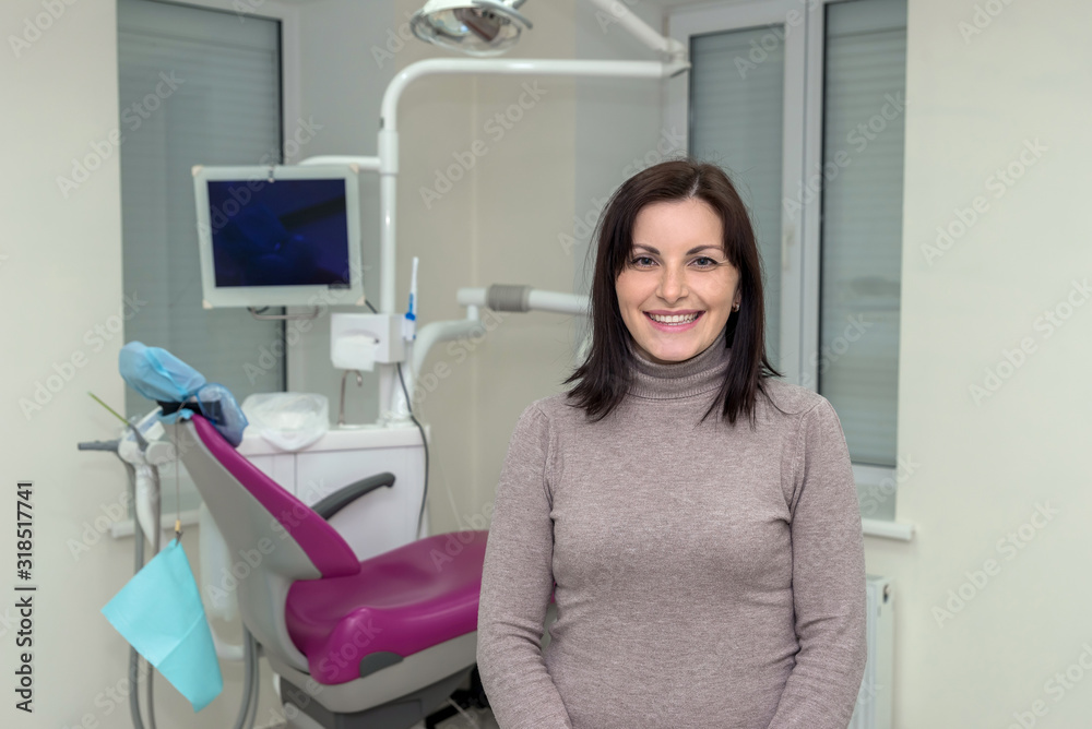 Smiling woman patient in dentistry after stomatological procedures Smiling woman patient in dentistry after stomatological procedures