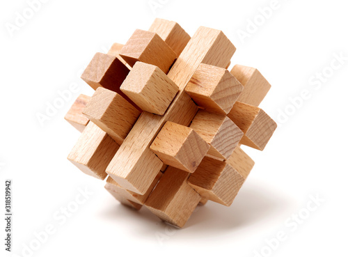 wooden puzzle over white background