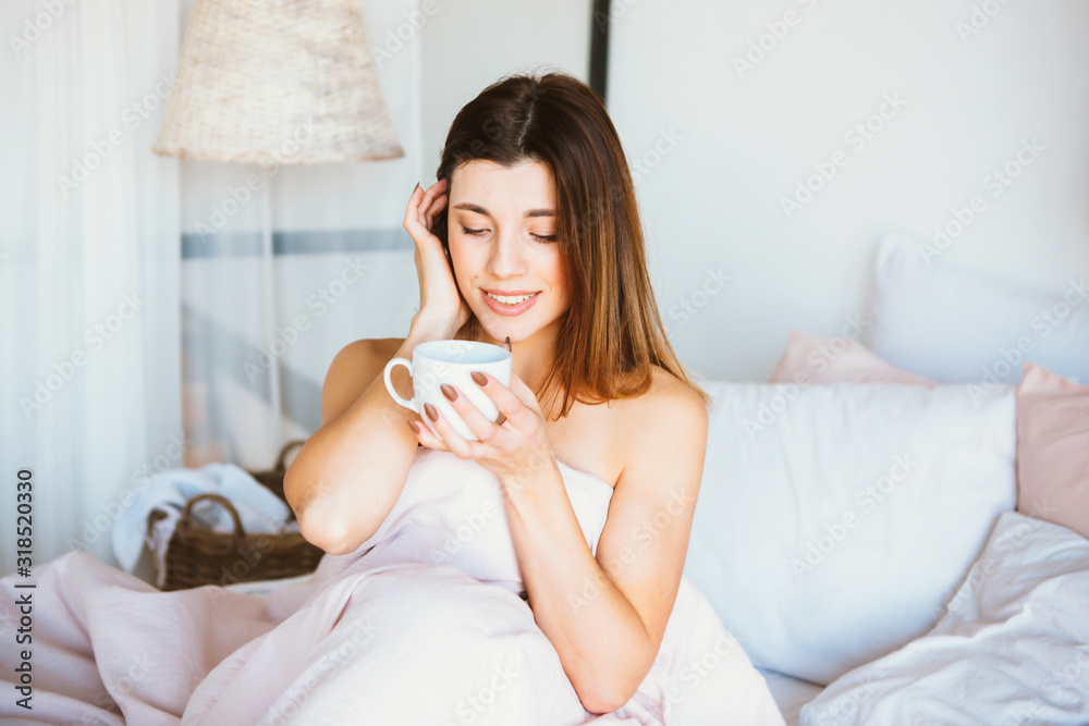 Woman woke up in bed. Woman drinking coffee in bed Woman woke up in bed. Woman drinking coffee in bed