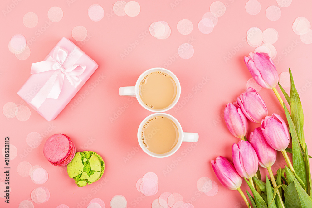 View from above tulips and gift box with confetti and copy space. Background for womens day, 8 March Valentines day, 14 february. Flat lay style, top view, mockup, template, overhead. Greeting card View from above tulips and gift box with confetti and copy space. Background for womens day, 8 March Valentines day, 14 february. Flat lay style, top view, mockup, template, overhead. Greeting card