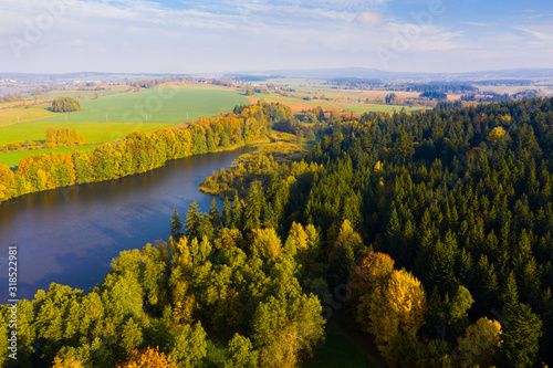 Impressive autumn landscape of trees and river