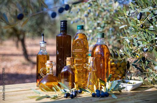Olive oil on wooden surface outdoors