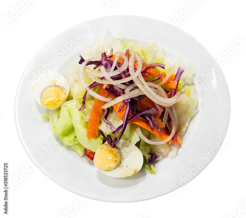 Appetizing salad with egg, carrots, onions and lettuce. Spanish dish