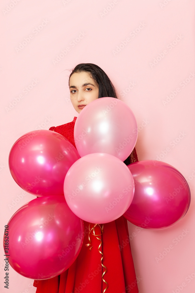 custom made wallpaper toronto digitalYoung pretty woman in red evening dress holding festive air balloons. Portrait of happy 20s middle-eastern female celebrating valentines day, birthday, party