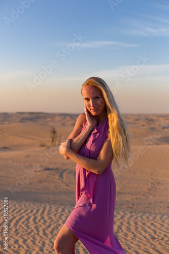 Blonde model in the desert at Emirates