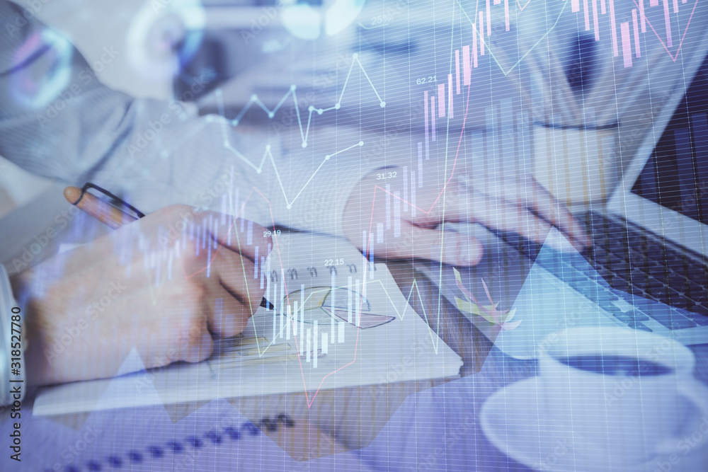 Multi exposure of stock market graph with man working on laptop on background. Concept of financial analysis. Multi exposure of stock market graph with man working on laptop on background. Concept of financial analysis.