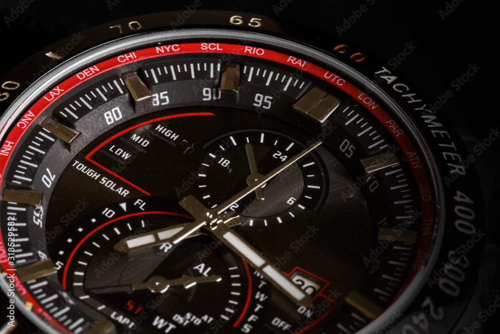 Luxury sport chronograph black Analog Men's Watch silver red steel for men luxury on black background - detail view Luxury sport chronograph black Analog Men's Watch silver red steel for men luxury on black background - detail view