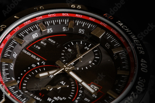 Luxury sport chronograph black Analog Men's Watch silver red steel for men luxury on black background - detail view