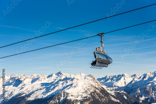 Ski cable lift in the Alps. Austrian Alps ski resort.