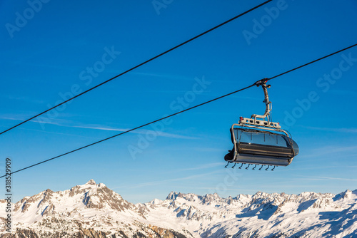 Ski cable lift in the Alps. Austrian Alps ski resort.