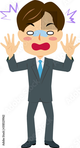 ショックを受けるスーツ姿の男性