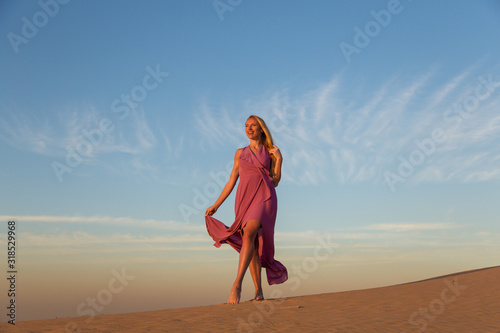 Blonde model in the desert at Emirates