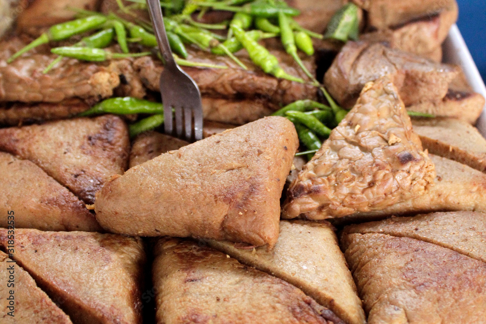 Indonesian Traditional food called by name tahu or tofu and tempe. this is a typical food in angkringan. Indonesian Traditional food called by name tahu or tofu and tempe. this is a typical food in angkringan.