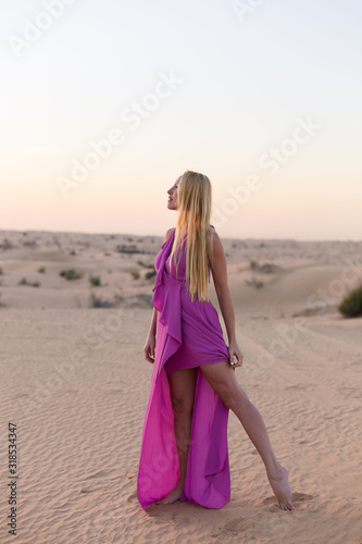 Blonde model in the desert in Emirates