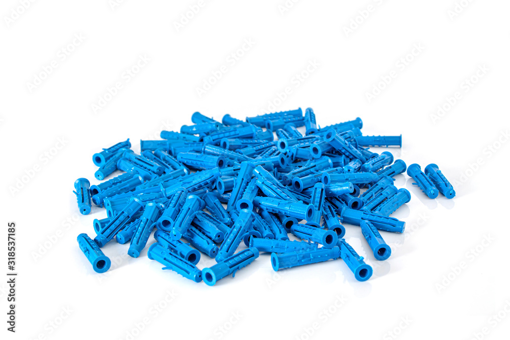 A bunch of blue plastic building dowels close-up on a white background. A bunch of blue plastic building dowels close-up on a white background.
