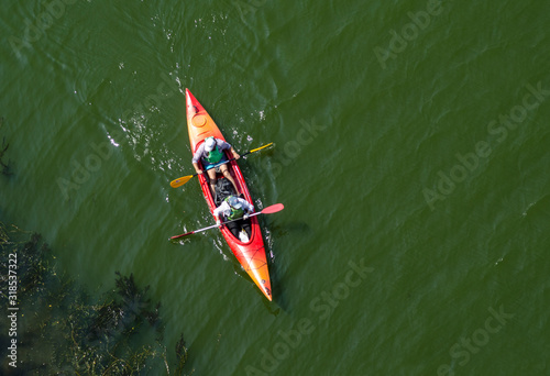 Ukraine, Zaporozhye, the Dnipro river, August 24, 2019 - two in a red kayak, view from above