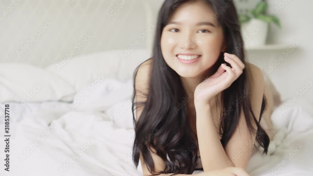Beautiful portrait young asian sexy woman lingerie lying and smile with wellbeing on the bed, girl in underwear confident in perfect with happy in the bedroom, lifestyle and relax concept. Beautiful portrait young asian sexy woman lingerie lying and smile with wellbeing on the bed, girl in underwear confident in perfect with happy in the bedroom, lifestyle and relax concept.