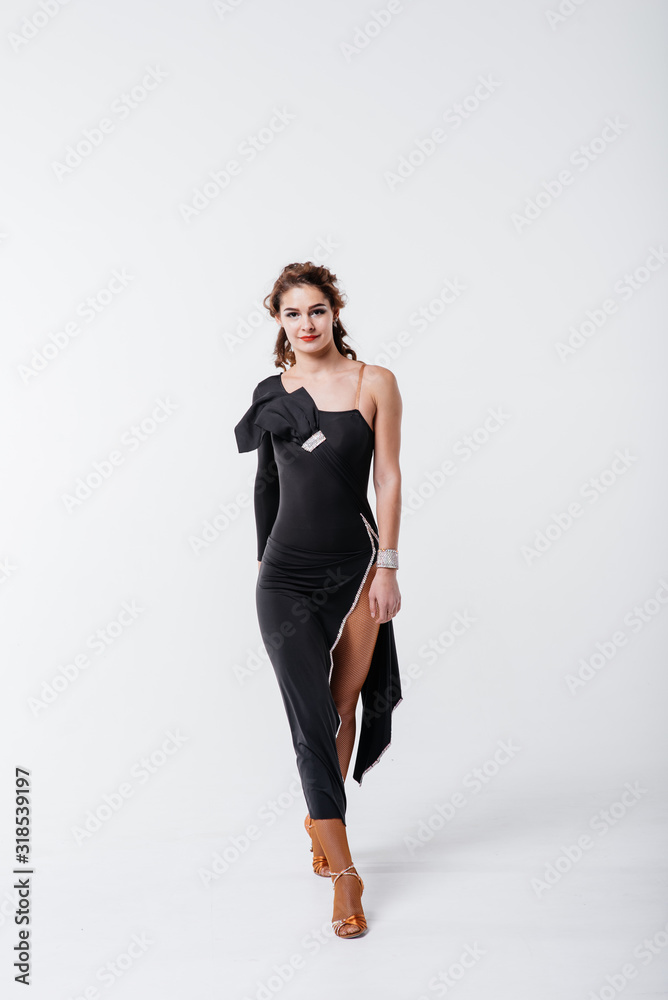 Dance school concept. Young beautiful dancer posing in studio. Dance school concept. Young beautiful dancer posing in studio.