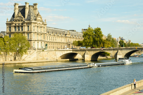 Cityscape with cargo ship and Palace Tuilleries photo