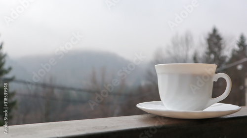 cup of coffee on wooden table