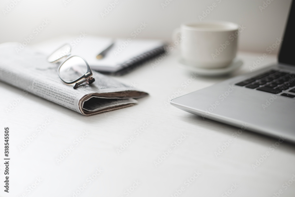Newspaper with morning news on the desktop. Newspaper with morning news on the desktop.