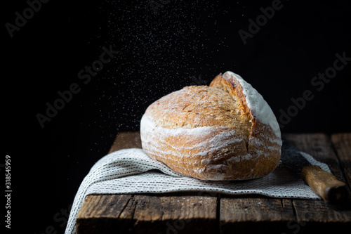 Fresh homemade crisp bread on wooden background. French bread. Bread at leaven. Unleavened bread