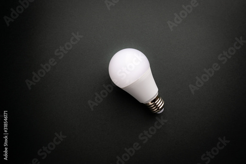 Creativity inspiration, ideas concepts with light bulb on dark color background.Flat lay design.