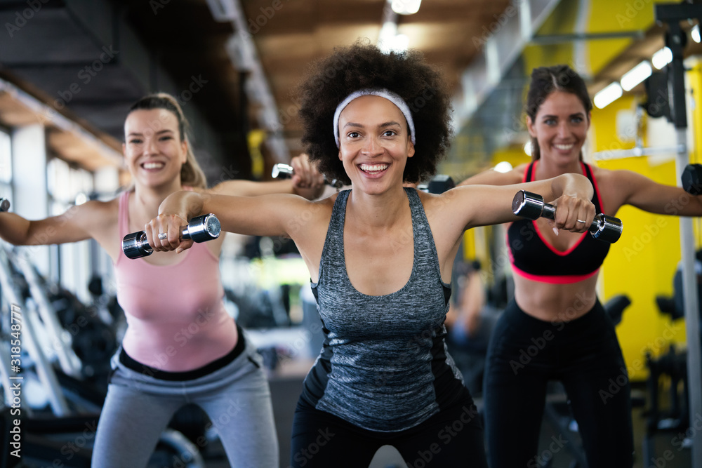 Picture of cheerful fit fitness team in gym Picture of cheerful fit fitness team in gym