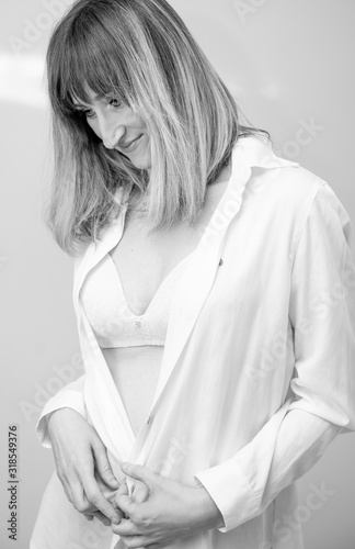 Pretty woman posing with white shirt