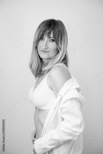 Pretty woman posing with white shirt