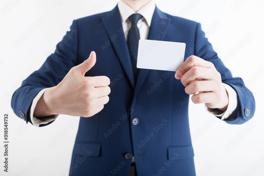 Man's hand showing business card - closeup shot on white background. Man's hand showing business card - closeup shot on white background.
