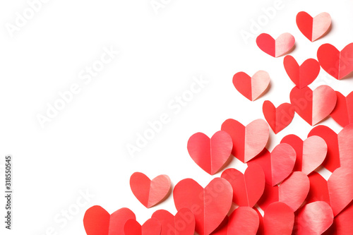 Cut out of red paper hearts on white background isolated.